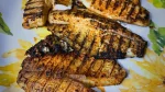 grilled tilapia filets on platter