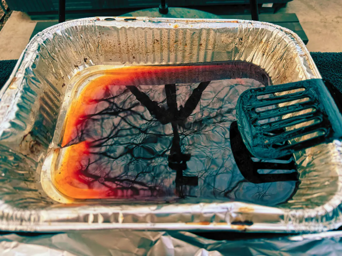 pan drippings from smoked pork butt in a foil pan
